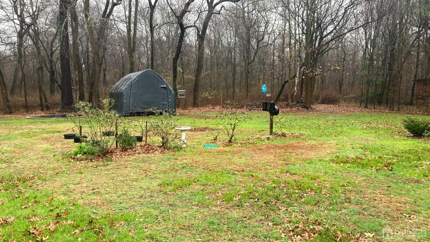 133 East Greystone Road Old Bridge, NJ 08857 - Photo 16 of 23 a backyard of a house with lots of green space and garden