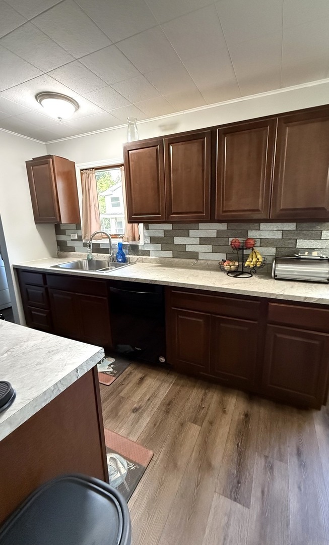 5199 Elmwood Road Oak Forest, IL 60452 - Photo 11 of 30 a kitchen with a sink and cabinets