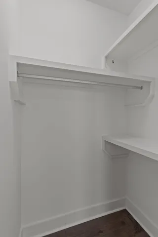 a view of an empty walk in closet