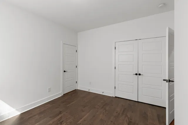 an empty room with wooden floor
