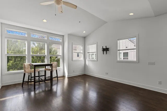 a view of workspace with furniture window and wooden floor