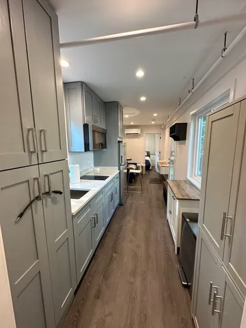 a bathroom with a sink toilet and mirror
