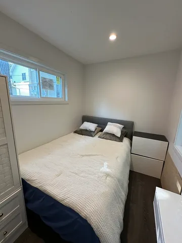 a bathroom with a shower a mirror and a shower