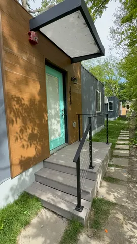 a view of a house with a cars park