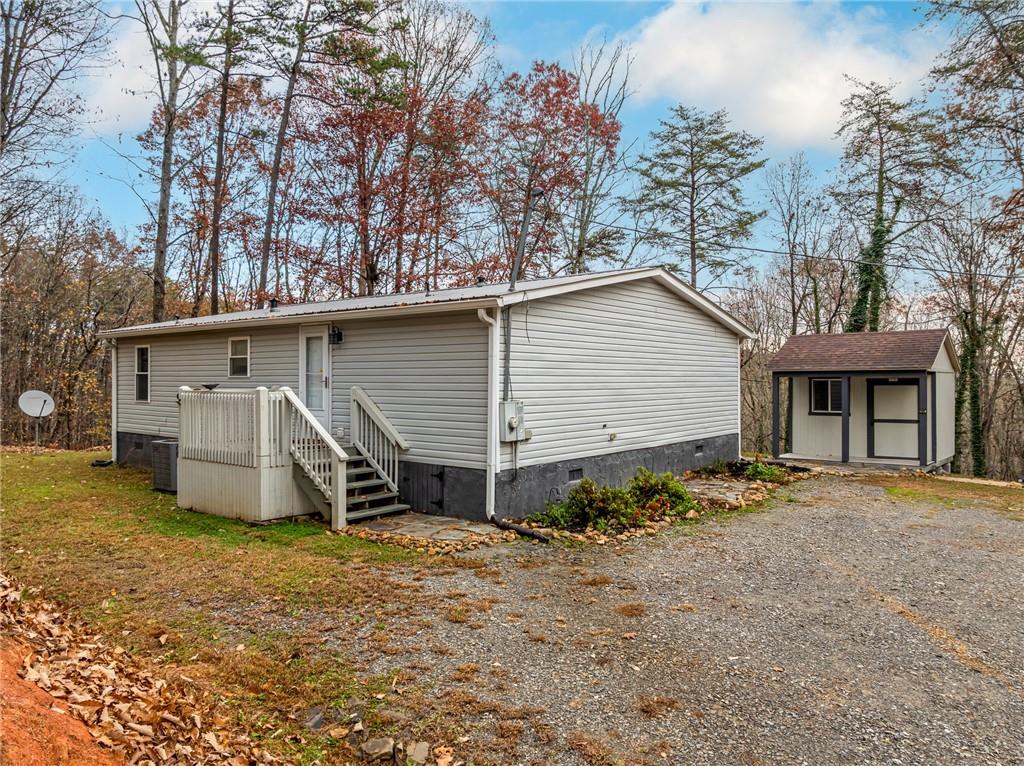 2038 Upper Salem Church Road Jasper, GA 30143 - Photo 2 of 25 a house with trees in the background