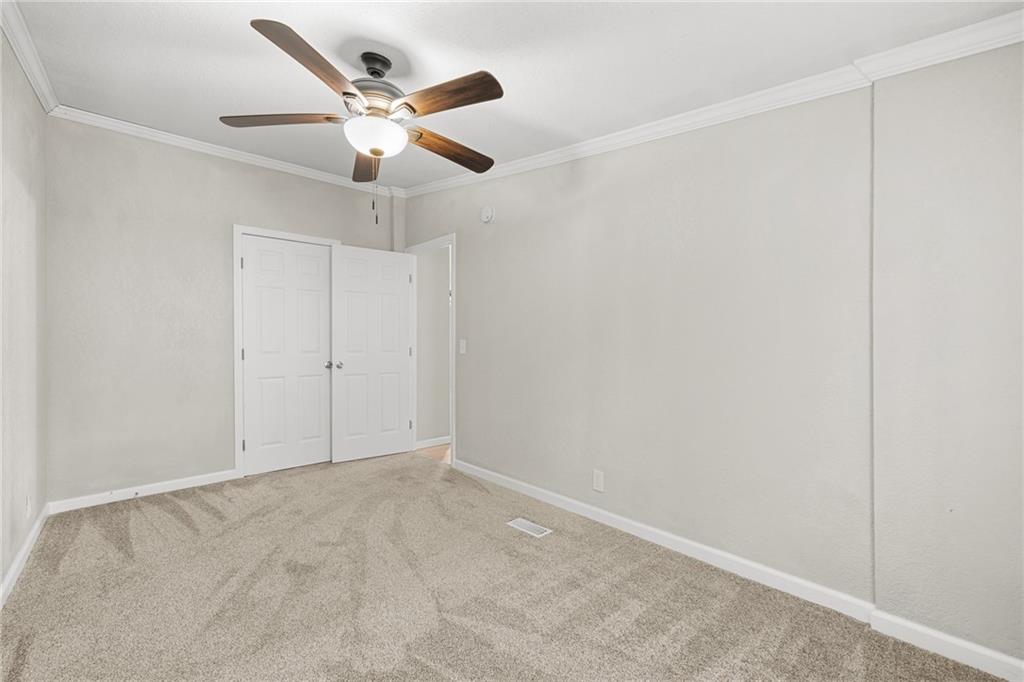 2038 Upper Salem Church Road Jasper, GA 30143 - Photo 21 of 25 an empty room with ceiling fan
