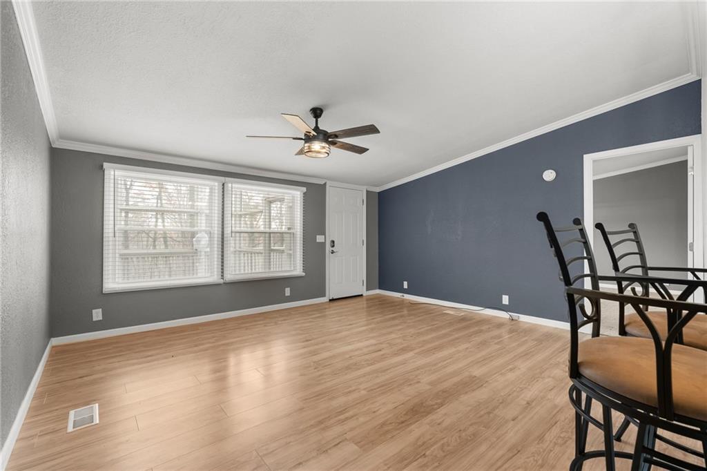 2038 Upper Salem Church Road Jasper, GA 30143 - Photo 9 of 25 a view of an empty room with windows and wooden floor