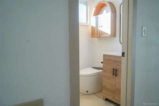 a bathroom with a toilet and a sink