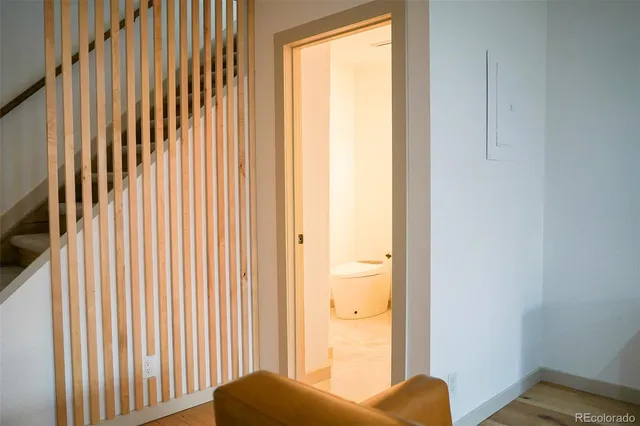 a view of a bedroom with a bed and a window