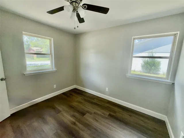a view of room with window and ceiling fan