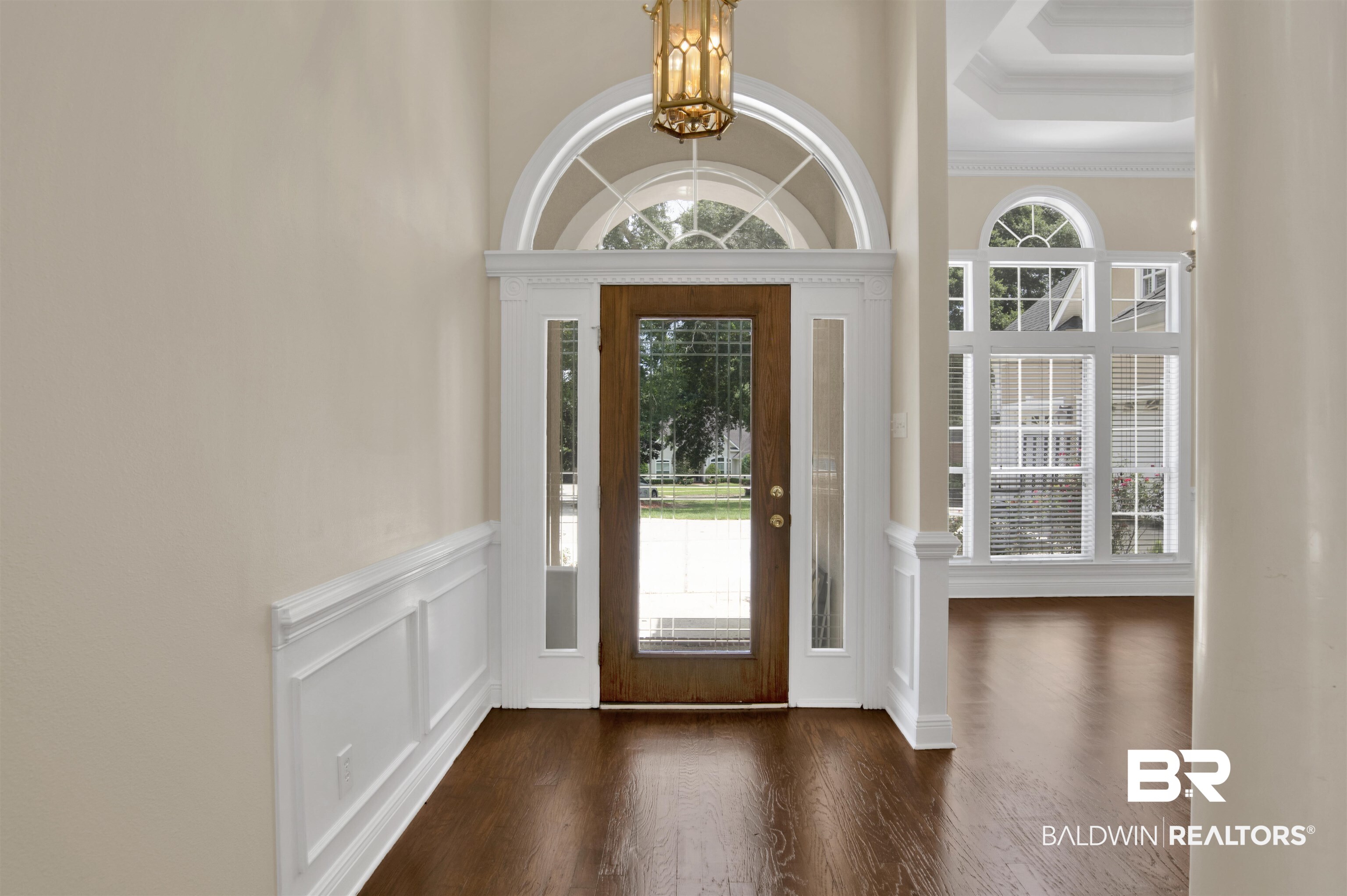 8847 Dawes Lake Road South Mobile, AL 36619 - Photo 5 of 47 Grand entryway featuring a wood-finish door with leaded glass, framed by side lights and an arched transom window