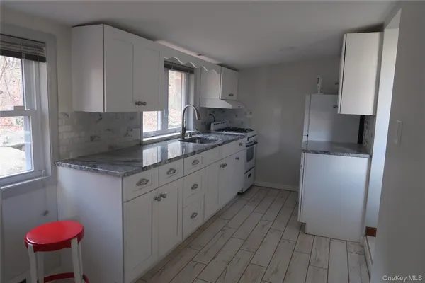 a view of empty room with windows