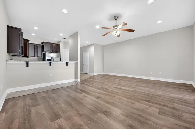 a view of kitchen with wooden floor and window