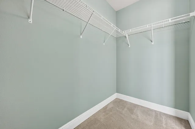 a bathroom with a granite countertop sink a large mirror and a vanity