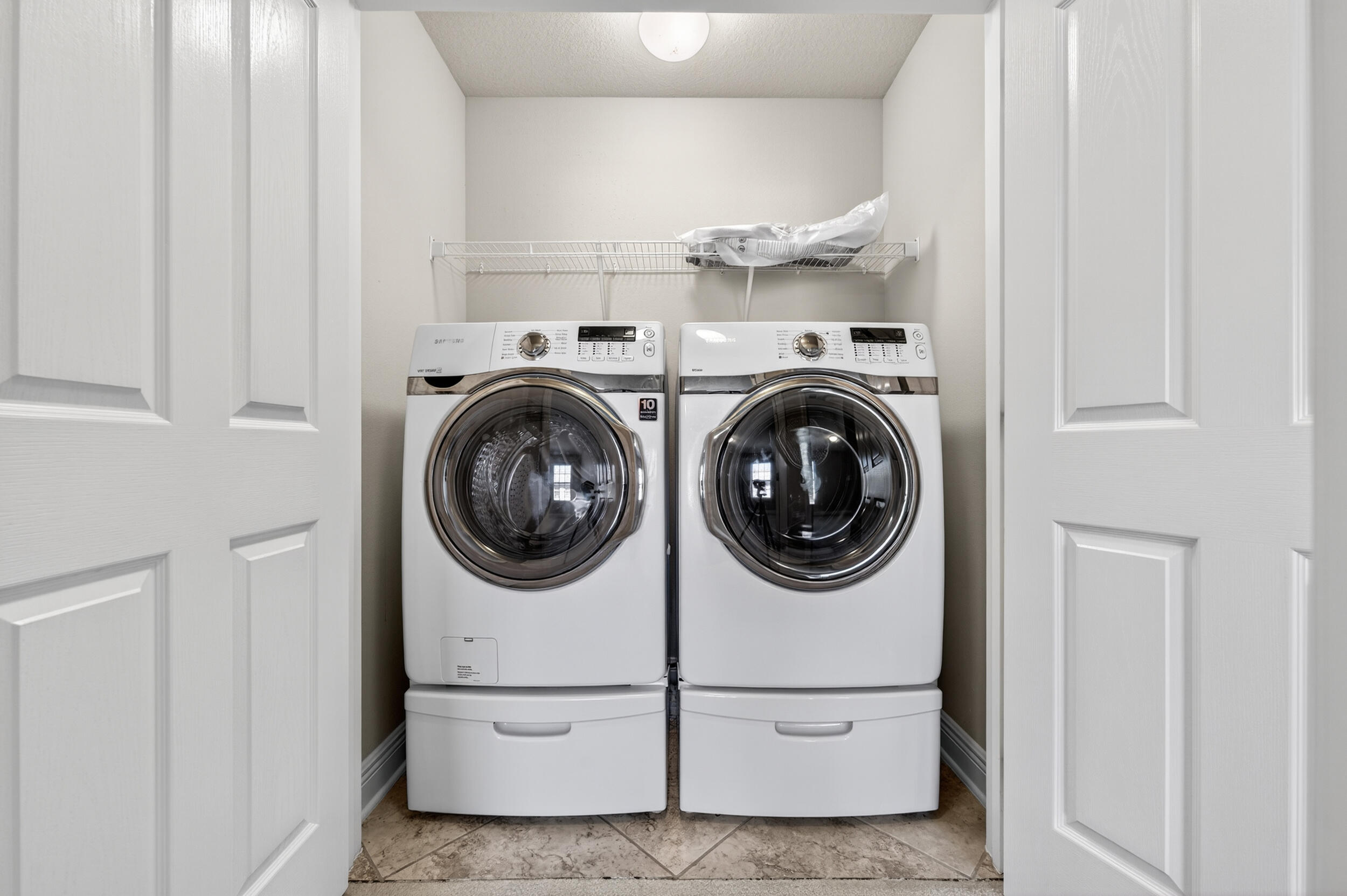 8900 White Ibis Way Navarre, FL 32566 - Photo 29 of 37 a utility room with dryer and washer