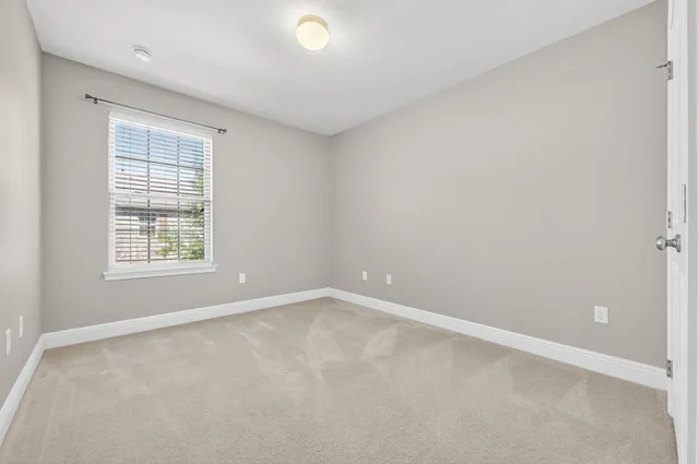 a bathroom with a granite countertop sink toilet a large mirror a bathtub and shower