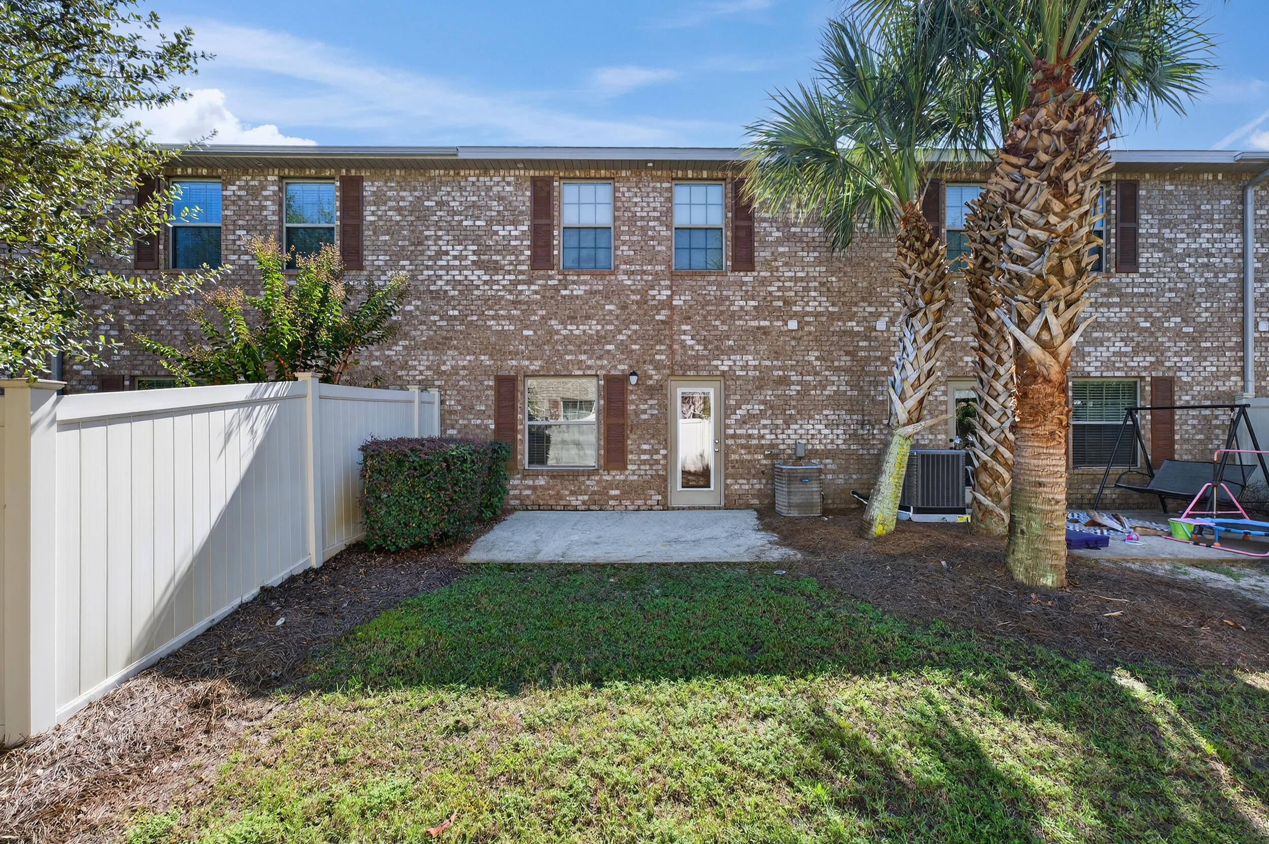 8900 White Ibis Way Navarre, FL 32566 - Photo 37 of 37 a front view of a house with garden