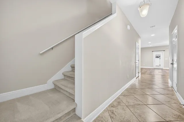 a view of hallway with stairs