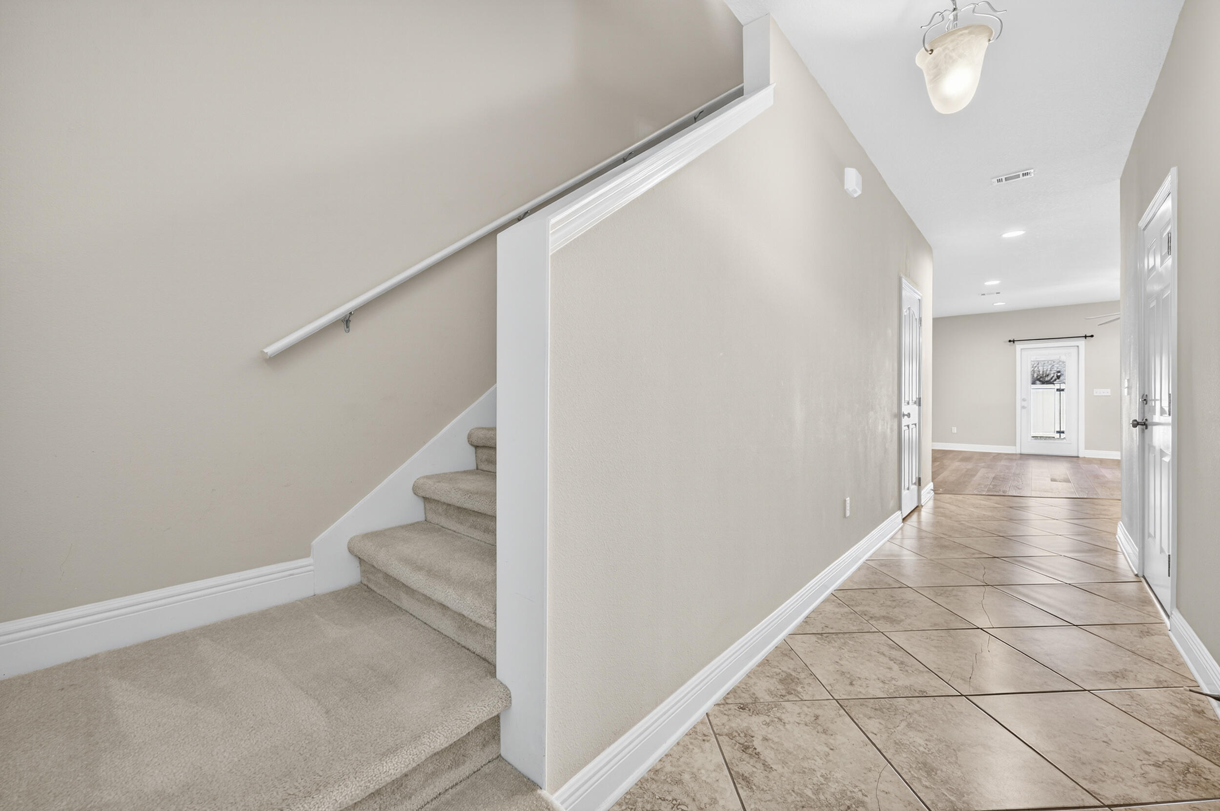 8900 White Ibis Way Navarre, FL 32566 - Photo 4 of 37 a view of hallway with stairs