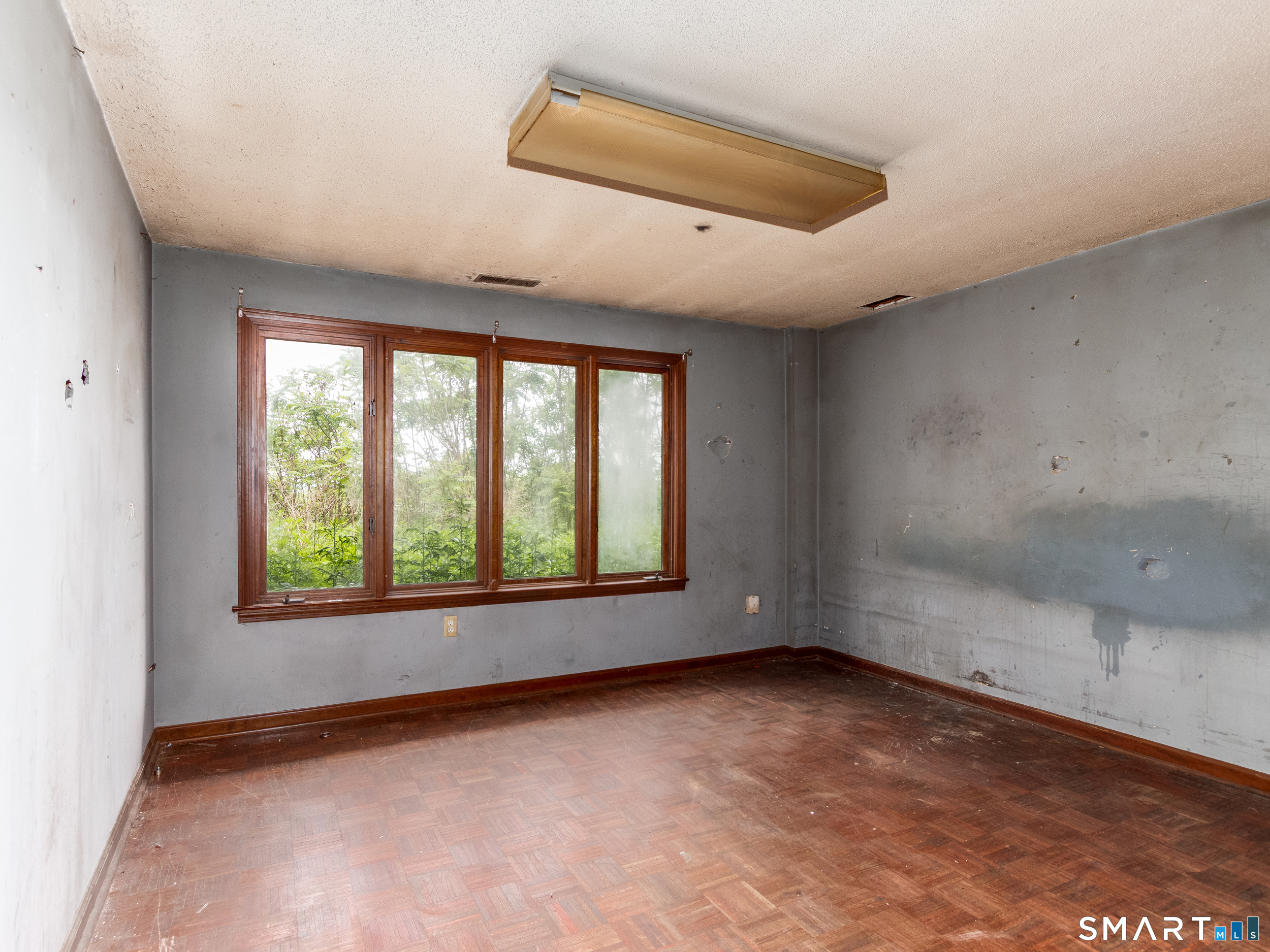 63 High Hill Road Wallingford, CT 06492 - Photo 28 of 34 an empty room with a empty space and windows
