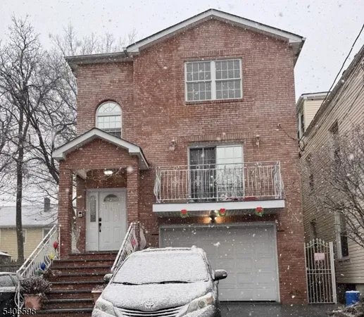 a front view of a house with garage