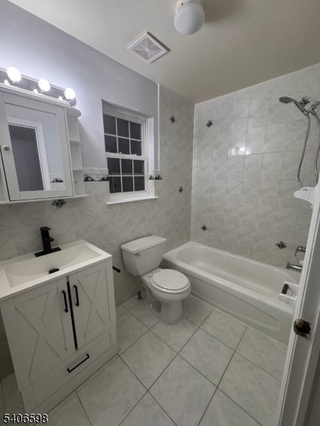 448 Catherine Street Elizabeth, NJ 07201 - Photo 11 of 11 a bathroom with a sink toilet and shower
