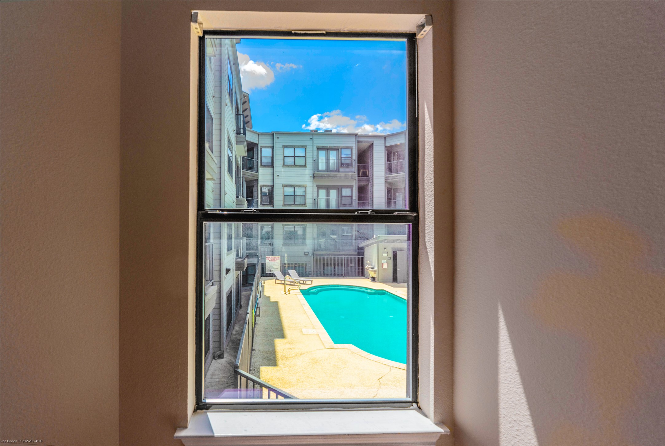 2502 Leon Street, Unit 305 Austin, TX 78705 - Photo 17 of 26 Pool view through bedroom window