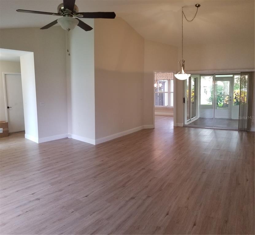 5810 Garden Lakes Majestic Bradenton, FL 34203 - Photo 11 of 28 a view of a room with window and wooden floor