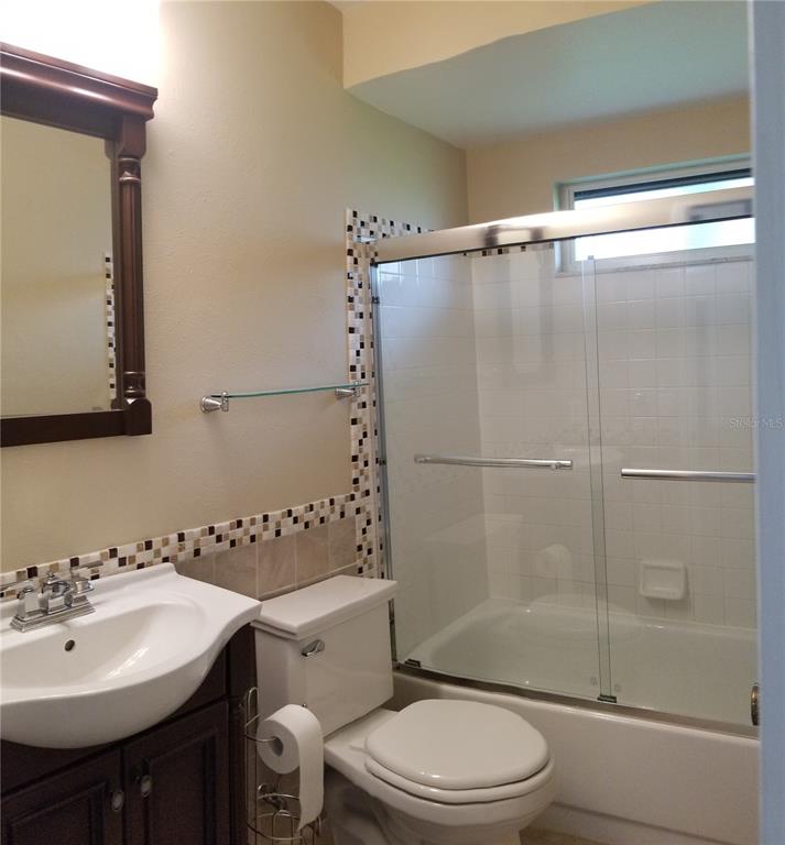 5810 Garden Lakes Majestic Bradenton, FL 34203 - Photo 23 of 28 a bathroom with a sink toilet and shower