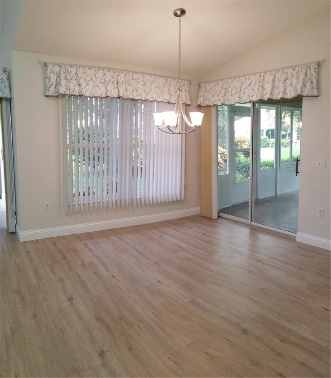 5810 Garden Lakes Majestic Bradenton, FL 34203 - Photo 10 of 28 an empty room with wooden floor and windows