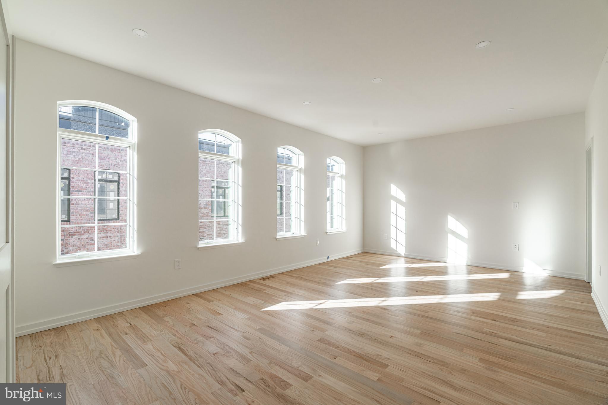 2423 Innovator Way Philadelphia, PA 19146 - Photo 17 of 34 a view of an empty room with wooden floor and a window