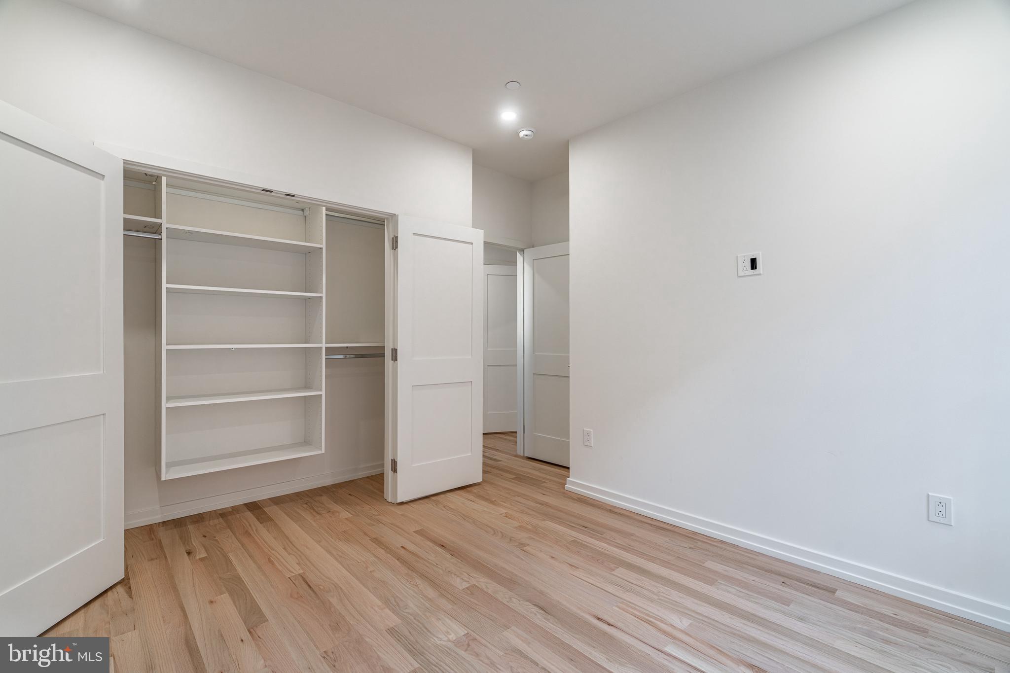 2423 Innovator Way Philadelphia, PA 19146 - Photo 20 of 34 a view of an empty room with a window and wooden floor