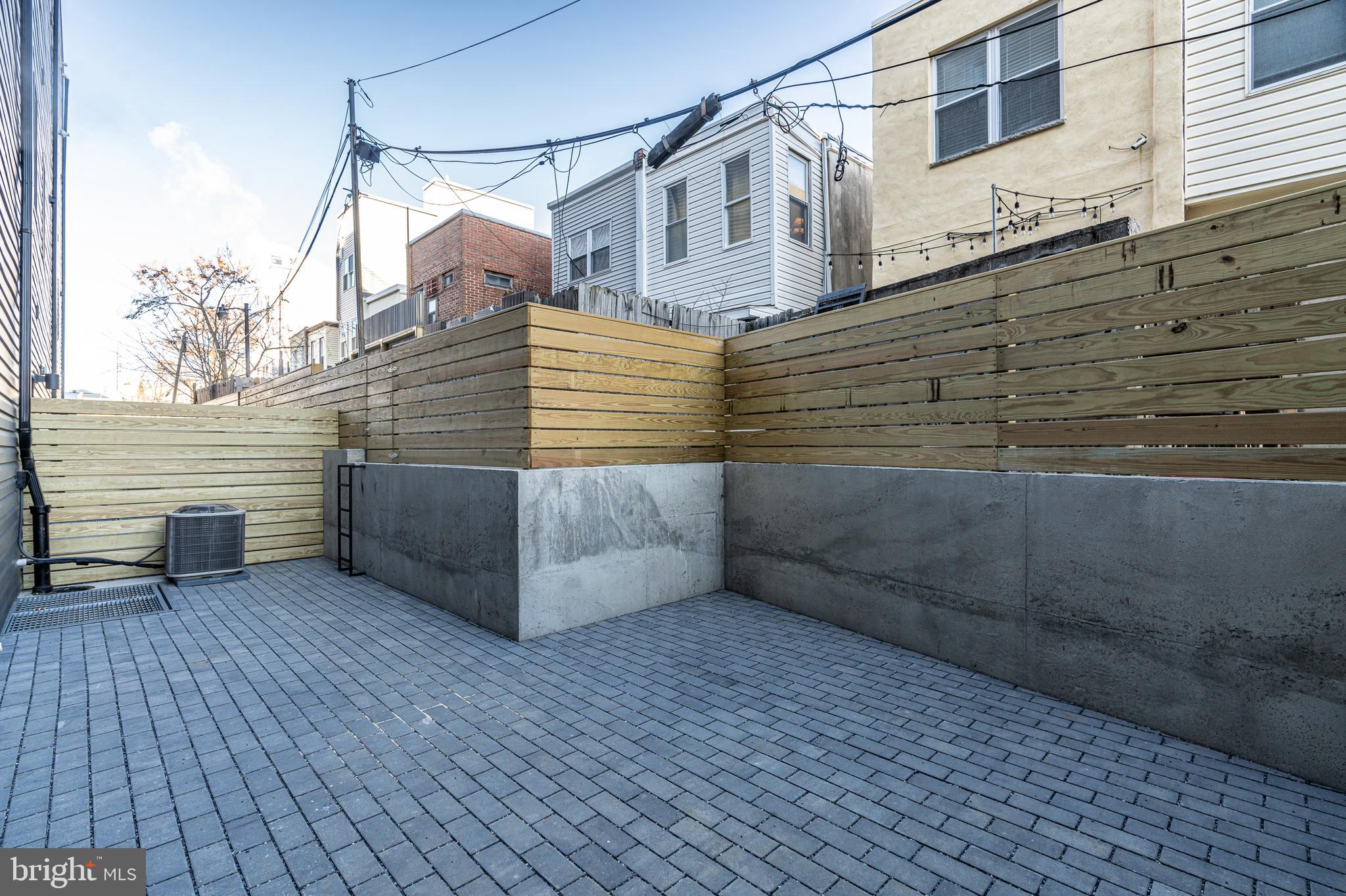 2423 Innovator Way Philadelphia, PA 19146 - Photo 7 of 34 a view of a house with a wooden fence