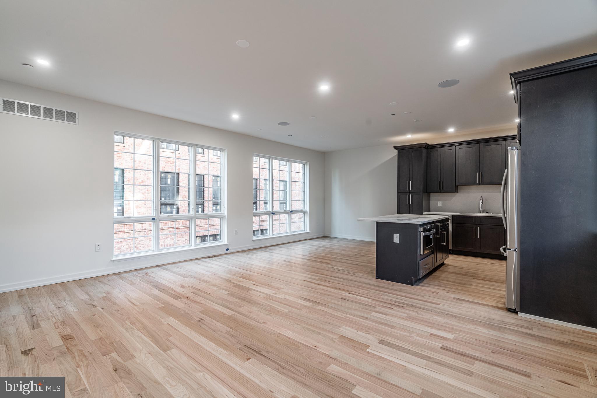 2423 Innovator Way Philadelphia, PA 19146 - Photo 8 of 34 a view of kitchen with a sink and dishwasher a oven with wooden floor