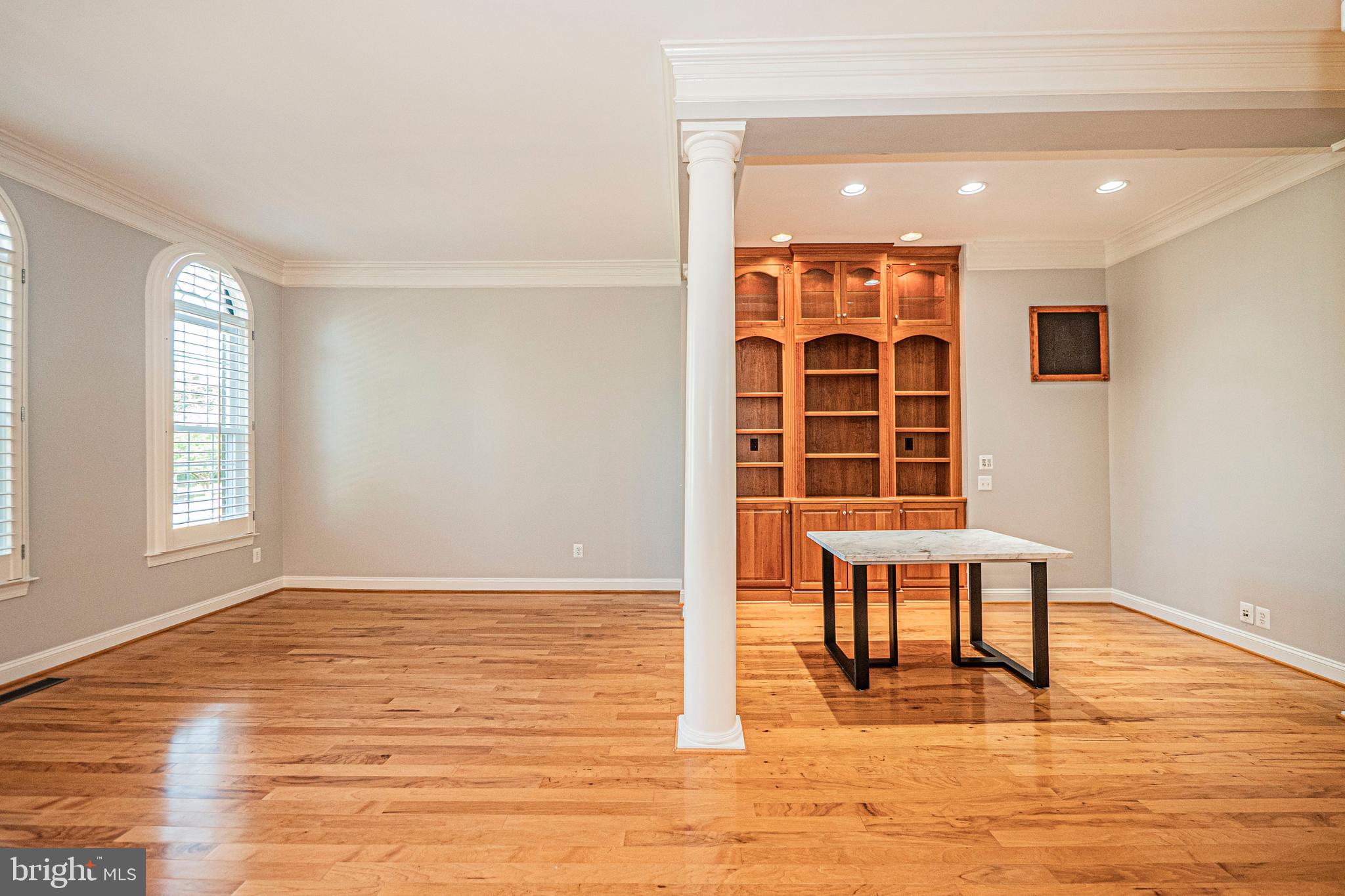 5448 Edsall Ridge Place Alexandria, VA 22312 - Photo 6 of 52 a view of a room with wooden floor and windows