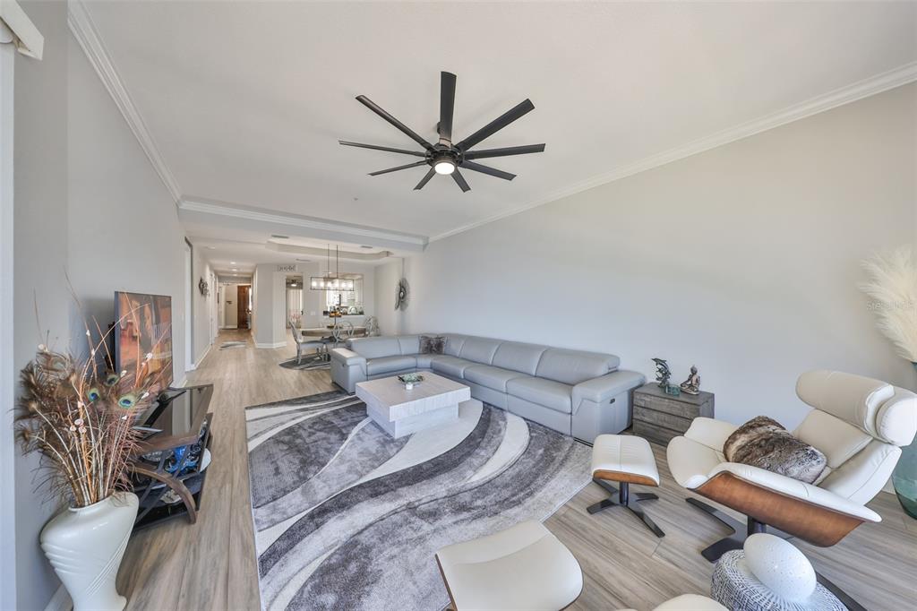 1038 Bellasol Way, Unit 202 Apollo Beach, FL 33572 - Photo 16 of 52 a bed room with two bed and a couch