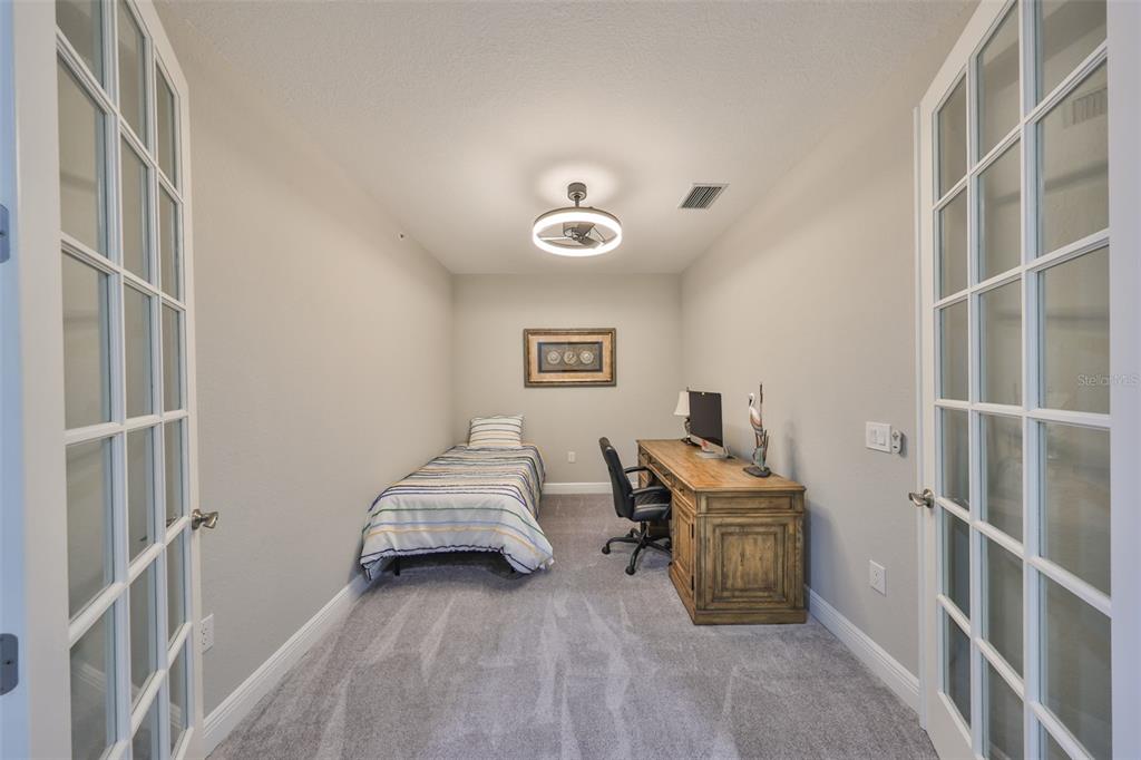 1038 Bellasol Way, Unit 202 Apollo Beach, FL 33572 - Photo 34 of 52 a bedroom with bed and window