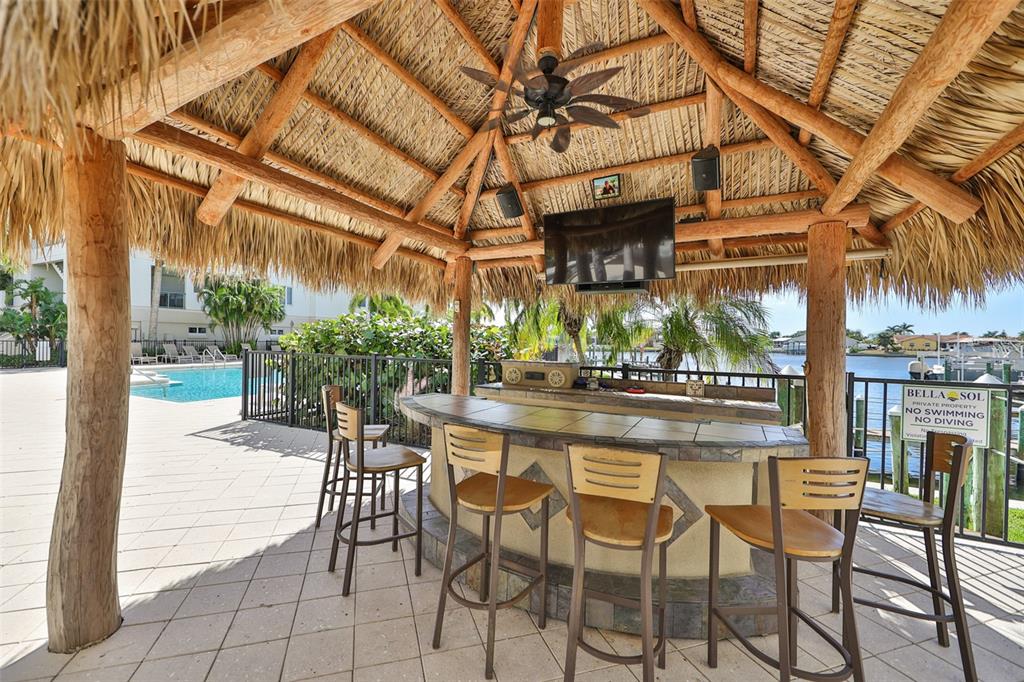 1038 Bellasol Way, Unit 202 Apollo Beach, FL 33572 - Photo 43 of 52 a view of a chairs and table in a patio