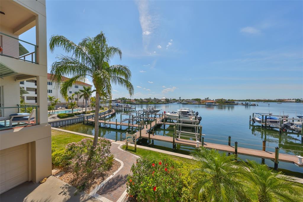 1038 Bellasol Way, Unit 202 Apollo Beach, FL 33572 - Photo 52 of 52 a view of a lake with a house