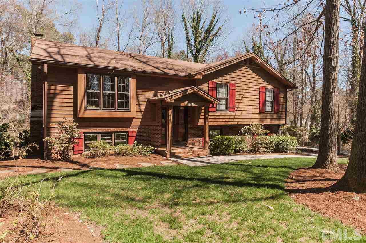 7008 Robbie Drive Raleigh, NC 27607 - Photo 1 of 21 a front view of house with a garden