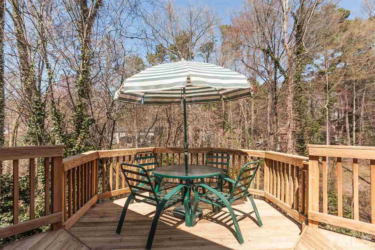 7008 Robbie Drive Raleigh, NC 27607 - Photo 18 of 21 a view of balcony with wooden floor and outdoor seating