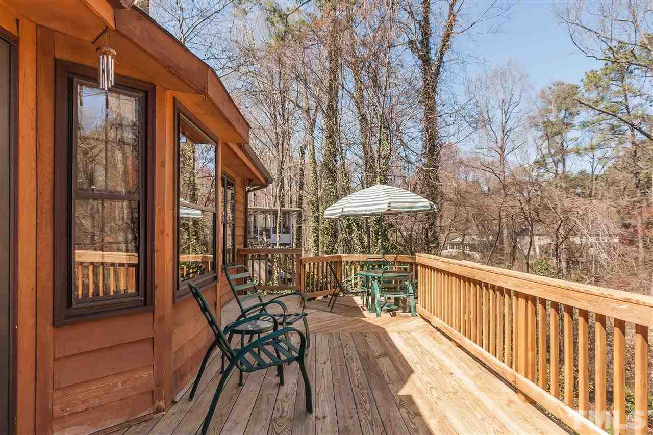 7008 Robbie Drive Raleigh, NC 27607 - Photo 19 of 21 a view of balcony with furniture and wooden floor