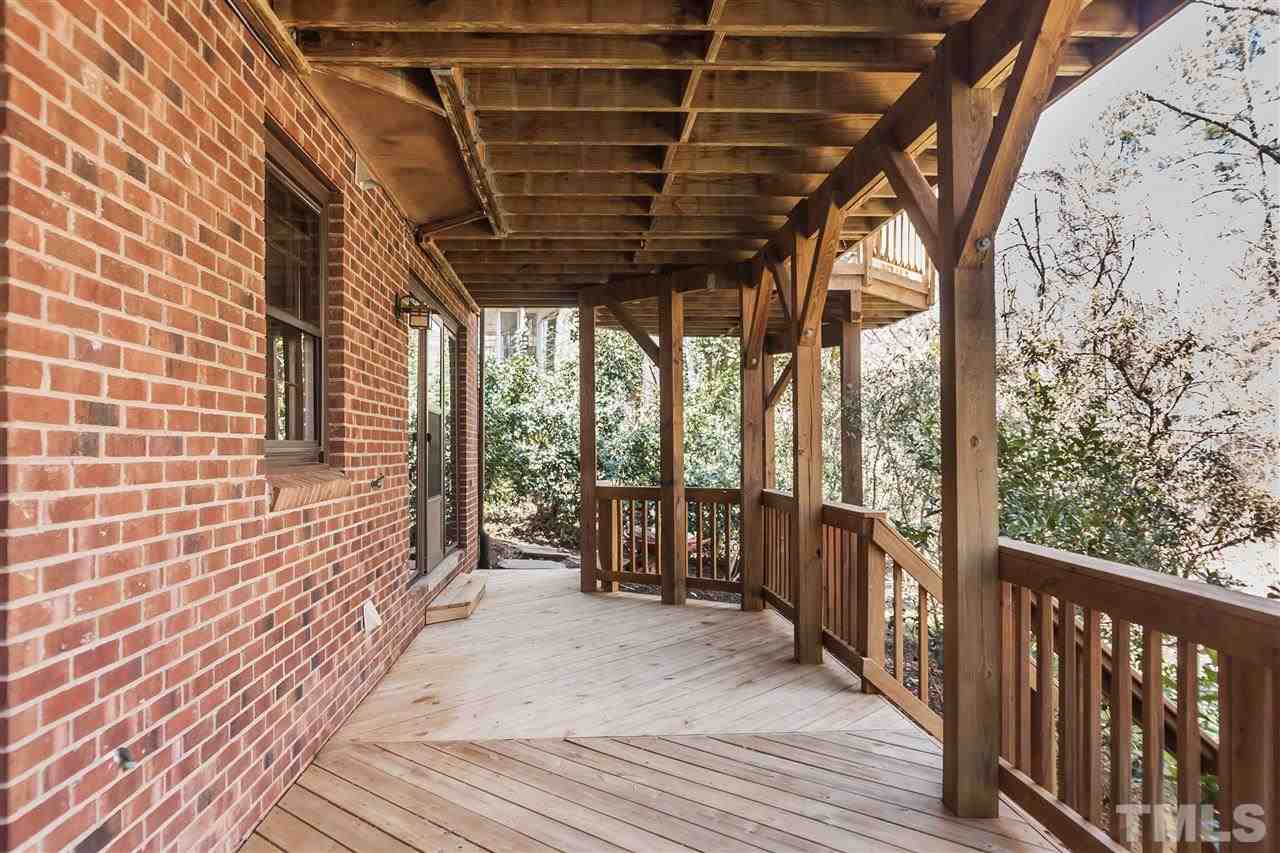 7008 Robbie Drive Raleigh, NC 27607 - Photo 21 of 21 a view of a porch with wooden floor and furniture