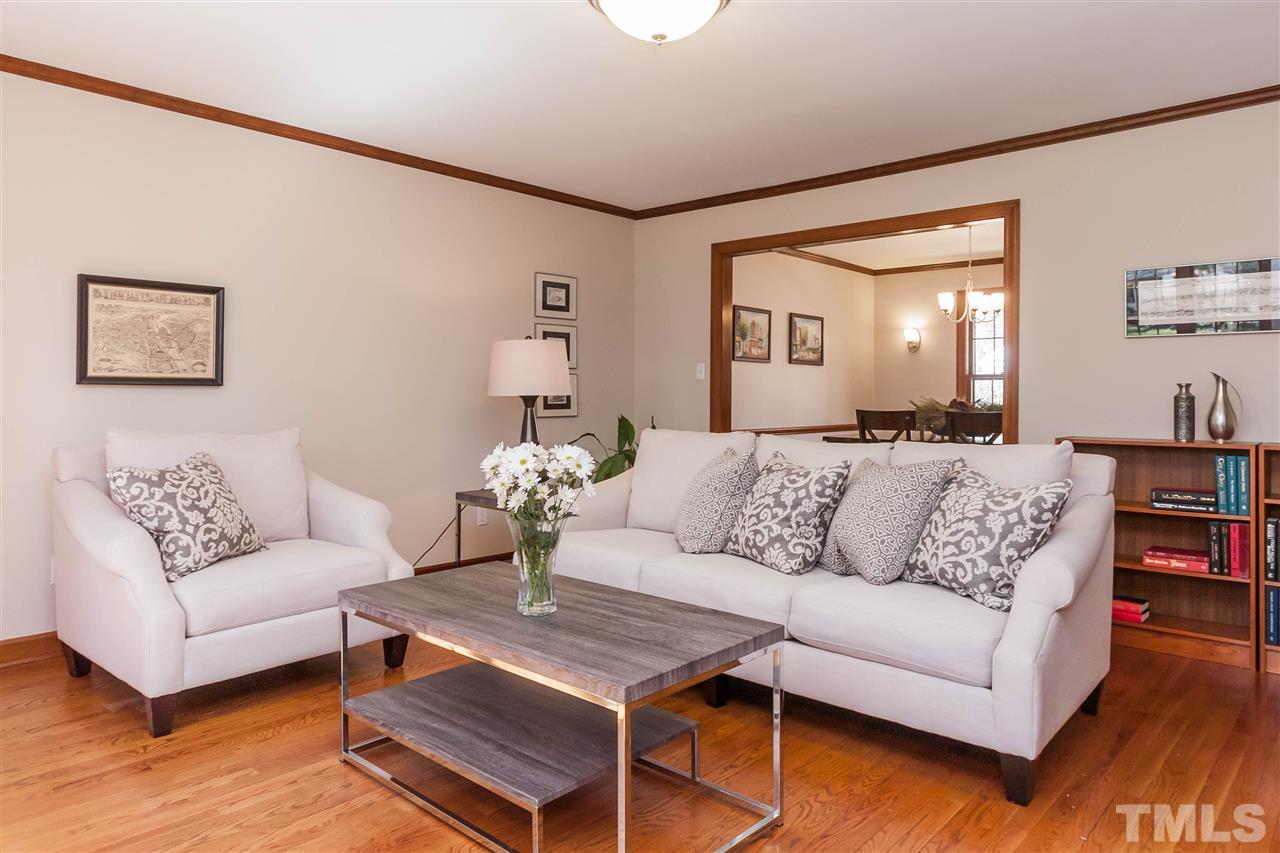 7008 Robbie Drive Raleigh, NC 27607 - Photo 5 of 21 a living room with furniture and a wooden floor