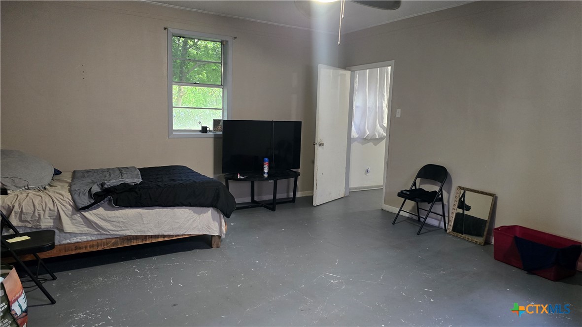 206 Cheeves Avenue Port Lavaca, TX 77979 - Photo 11 of 28 a bedroom with a bed and a window