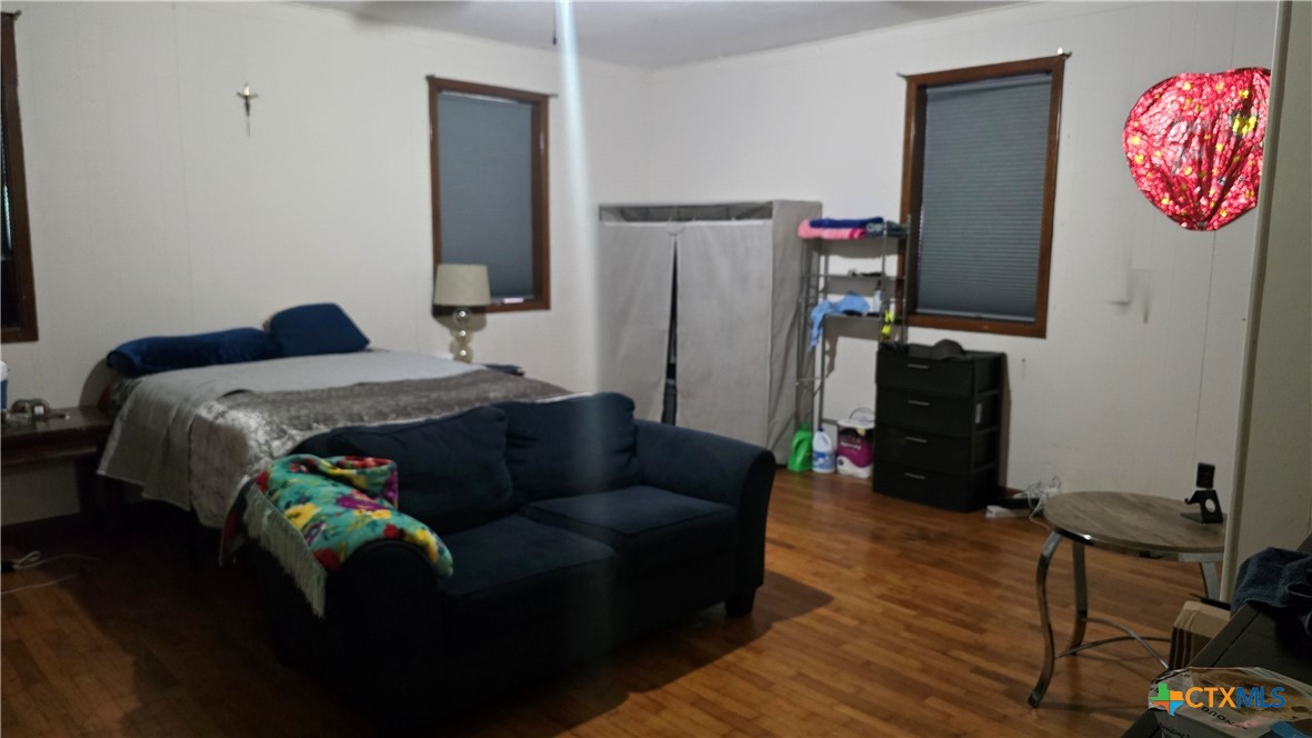 206 Cheeves Avenue Port Lavaca, TX 77979 - Photo 13 of 28 a bedroom with bed and a window