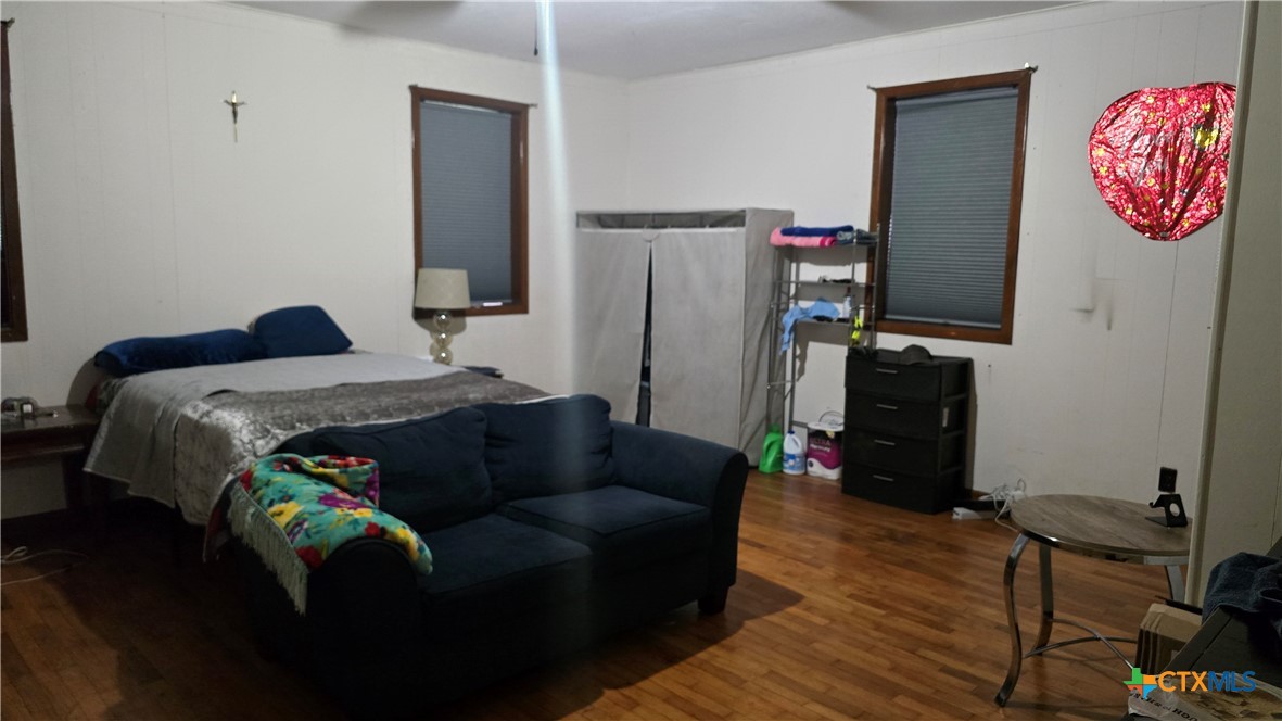 206 Cheeves Avenue Port Lavaca, TX 77979 - Photo 17 of 28 a bedroom with bed and a window