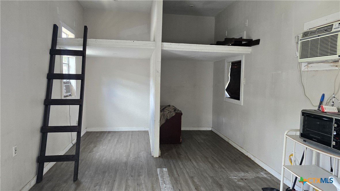 206 Cheeves Avenue Port Lavaca, TX 77979 - Photo 19 of 28 a view of wooden floor and a workspace