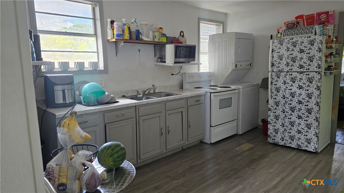206 Cheeves Avenue Port Lavaca, TX 77979 - Photo 23 of 28 a kitchen with a sink cabinets and window