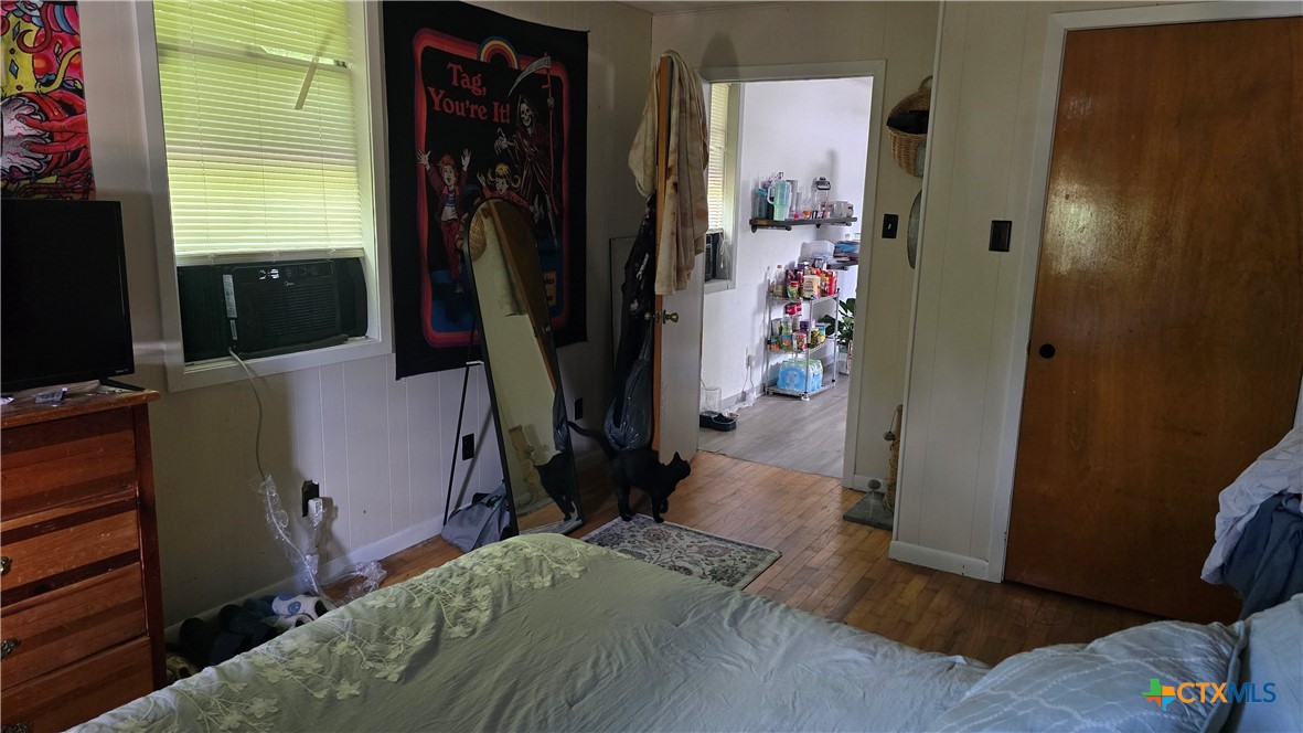 206 Cheeves Avenue Port Lavaca, TX 77979 - Photo 27 of 28 a bedroom with a bed closet and a flat tv screen